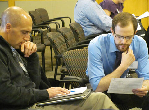 Ben Hager and Steve Middleton prepare their arguments for the property tax exercise.