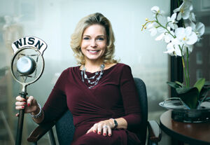 Michelle Vetterkind at her Wisconsin Broadcasters Association office. The microphone was donated to WBA by Gov. Lee Dreyfus, whose father used it on his Milwaukee radio show in the 1930s.