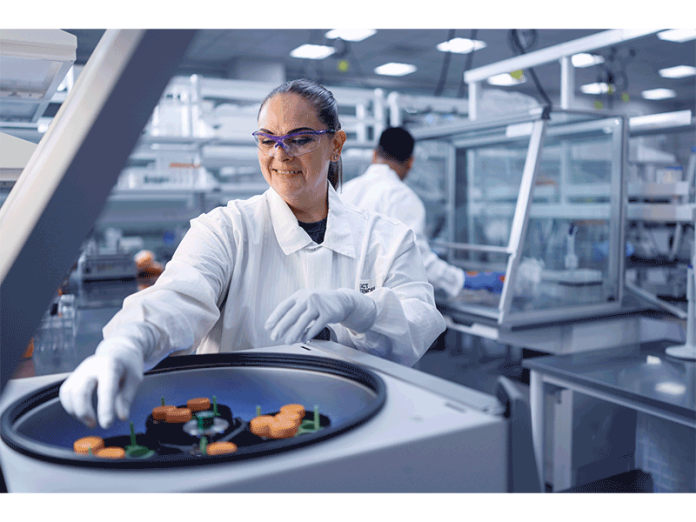 An Exact Sciences employee at work in the company's Madison laboratory. The company reported record revenue of $811 million in Q2 2025.
