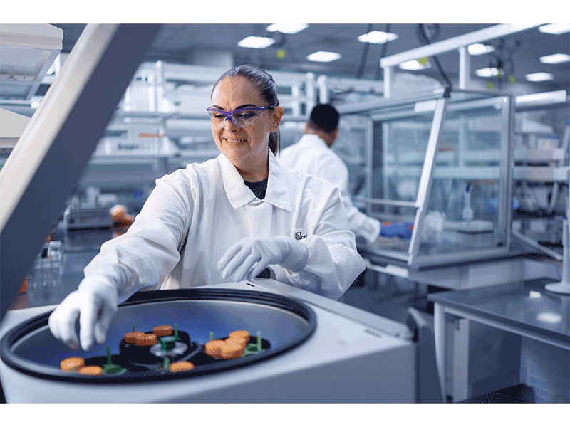 An Exact Sciences employee at work in the company's Madison laboratory. The company reported record revenue of $811 million in Q2 2025.