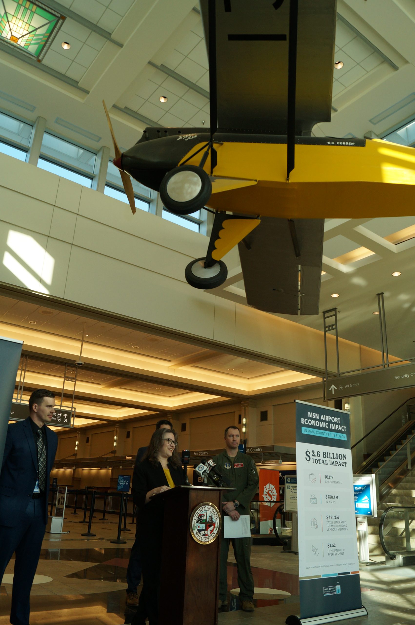 From left: Dane Country Regional Airport director Mark Papko and Dane County Executive Melissa Agard present economic impact information at a Feb. 18, 2026, media event.
