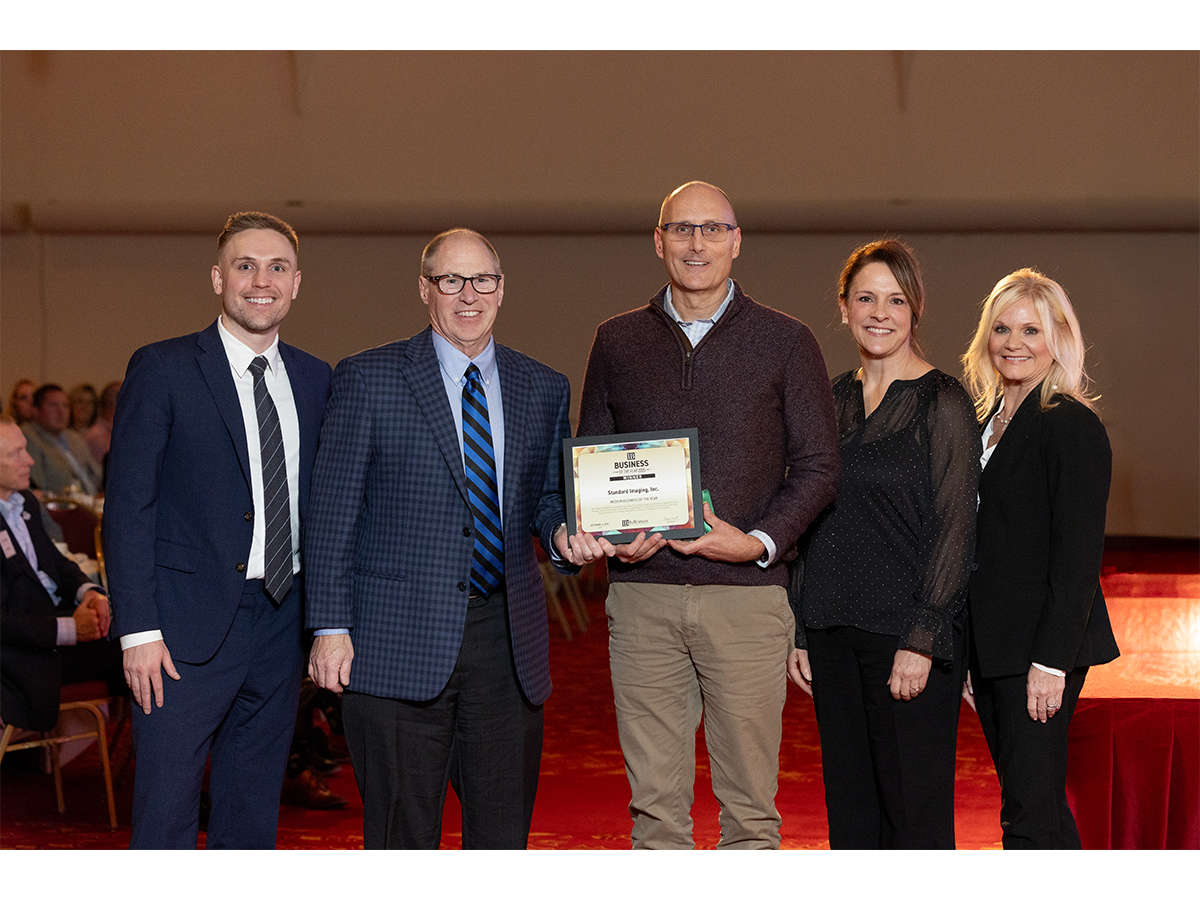Standard Imaging CEO Eric DeWerd accepts the company's award.