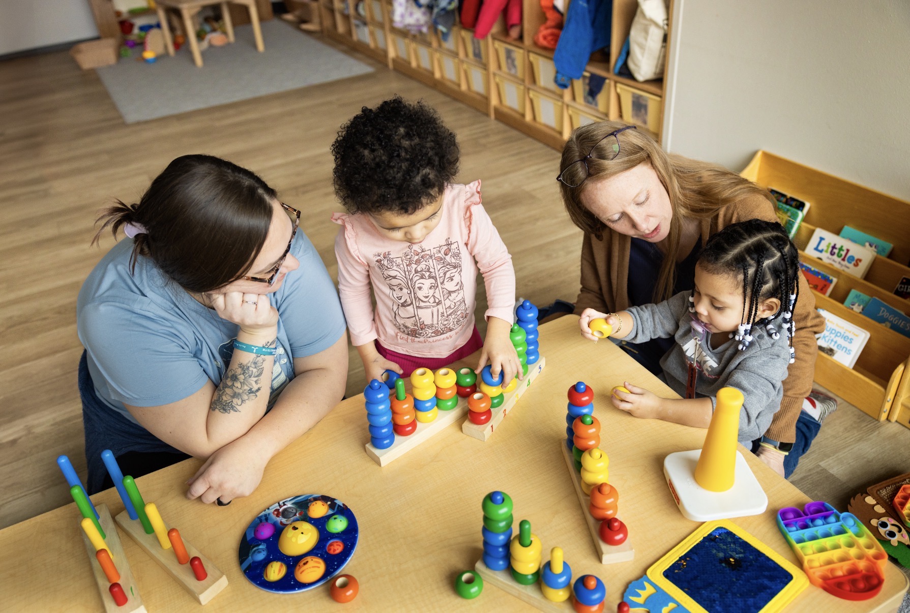Lisa Fiala (second from right) is the executive director of Red Caboose Child Care Center in Madison. In an interview earlier this year, Fiala said there is still work to be done to create a more sustainable model for child care. Photo credit: Sharon Vanorny.