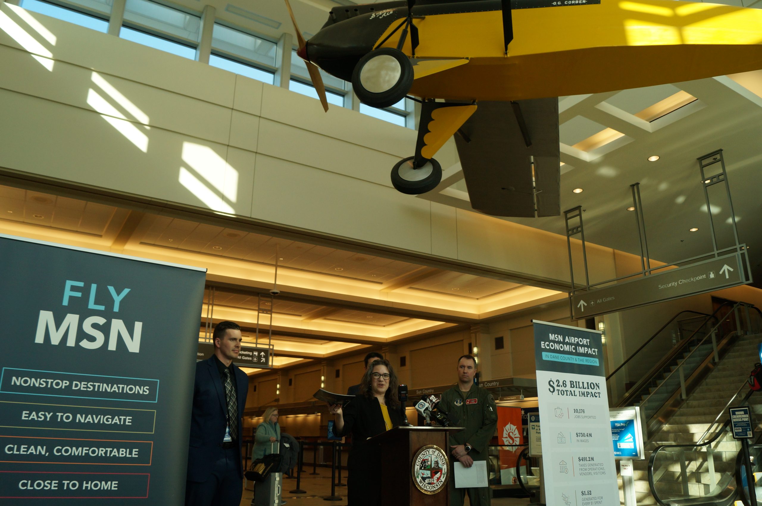 From left: Dane Country Regional Airport director Mark Papko and Dane County Executive Melissa Agard present economic impact information at a Feb. 18, 2026, media event.