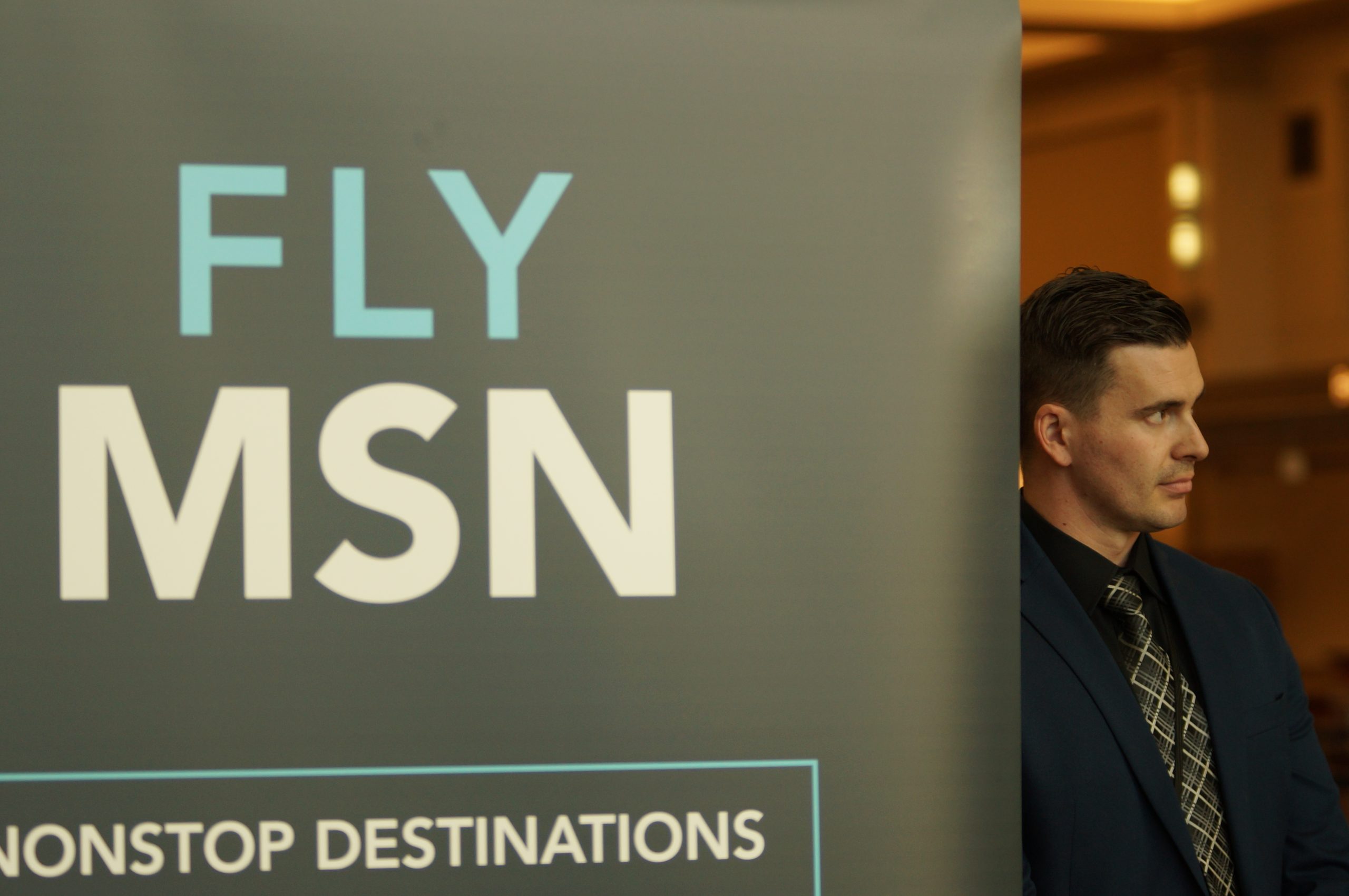 From left: Dane Country Regional Airport director Mark Papko presents economic impact information at a Feb. 18, 2026, media event.