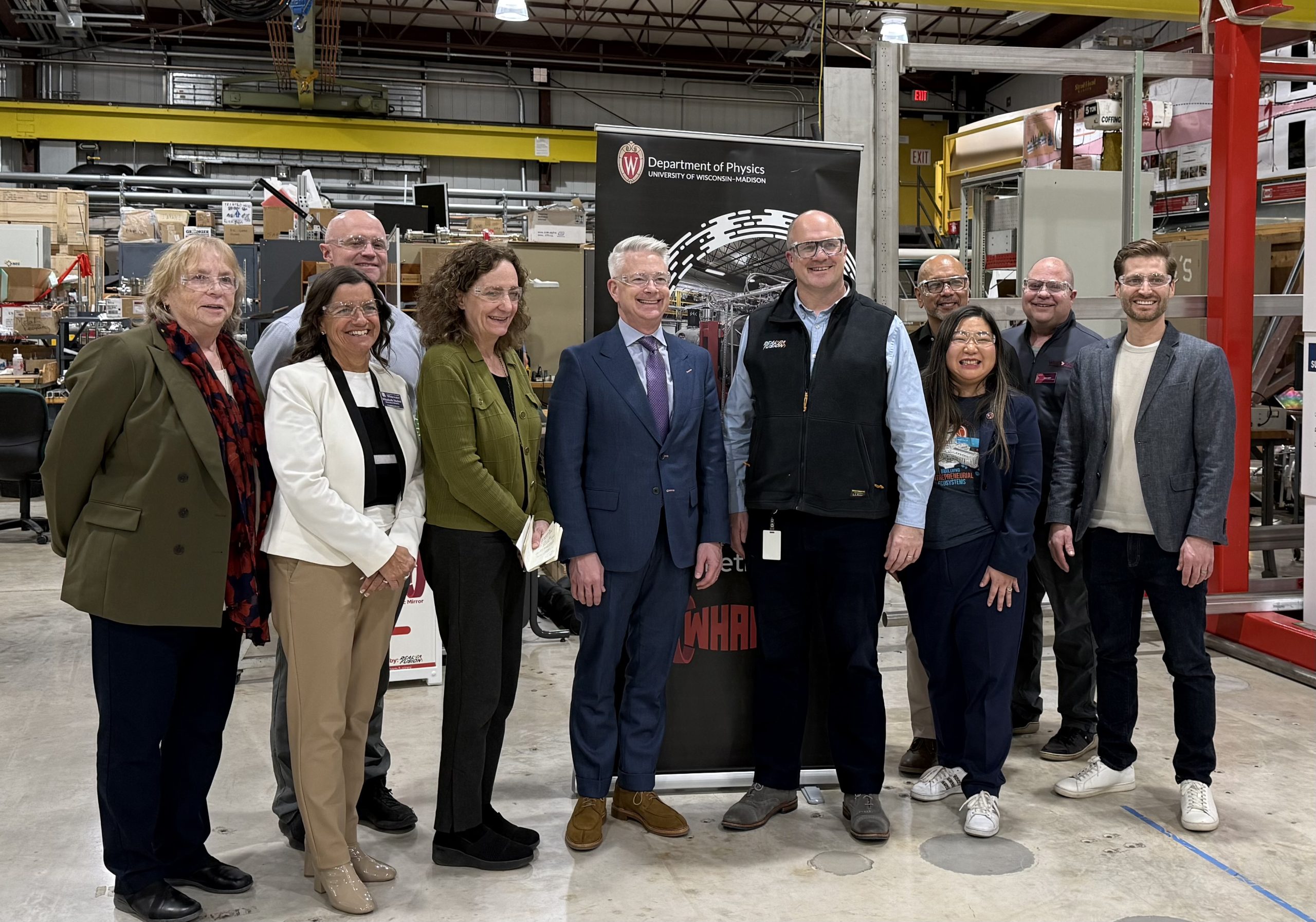 Realta CEO Kieran Furlong (center right) hosted members of the Wisconsin Fusion Energy Coalition and WEDC at the UW-Madison Physical Sciences Lab to discuss the company's future growth.