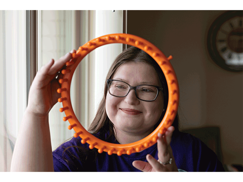 Melissa Loerke Hagan poses with a knitting loom.