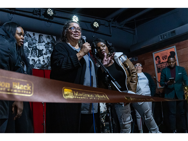 Rita Adair, center, speaks at the grand opening of Bernell's last month.