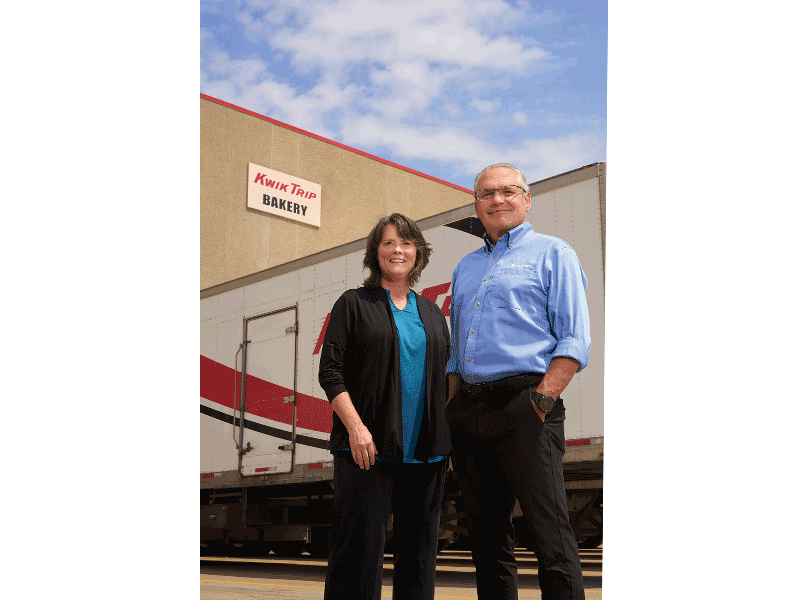 Deb Brazil, convenience transportation recruiter for Kwik Trip, stands with CEO Scott Zietlow in front of one of the many trucks in the company's fleet at its La Crosse headquarters.