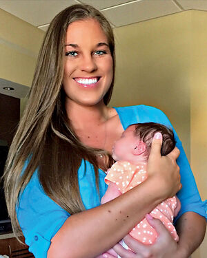 No sweat: Our intrepid author holds baby Aubrey — more inspiration than perspiration.