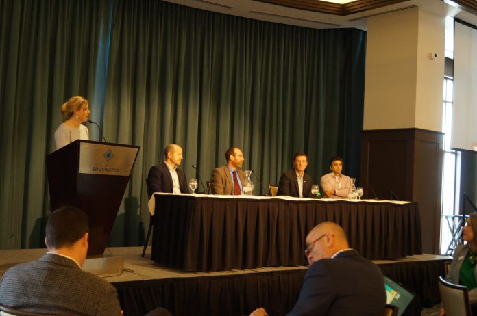 IB Madison staff reporter Brittney Kenaston moderates the data center panel at IB Madison's Real Estate & Construction Symposium. From left: panelists Alex Allon, community development director for the village of DeForest; Tyler Byrnes, senior research associate for the Wisconsin Policy Forum; Coleman Peiffer, senior manger of data center services at Alliant Energy; and Kevin Ramakrishna, shareholder in Reinhart's real estate practice.