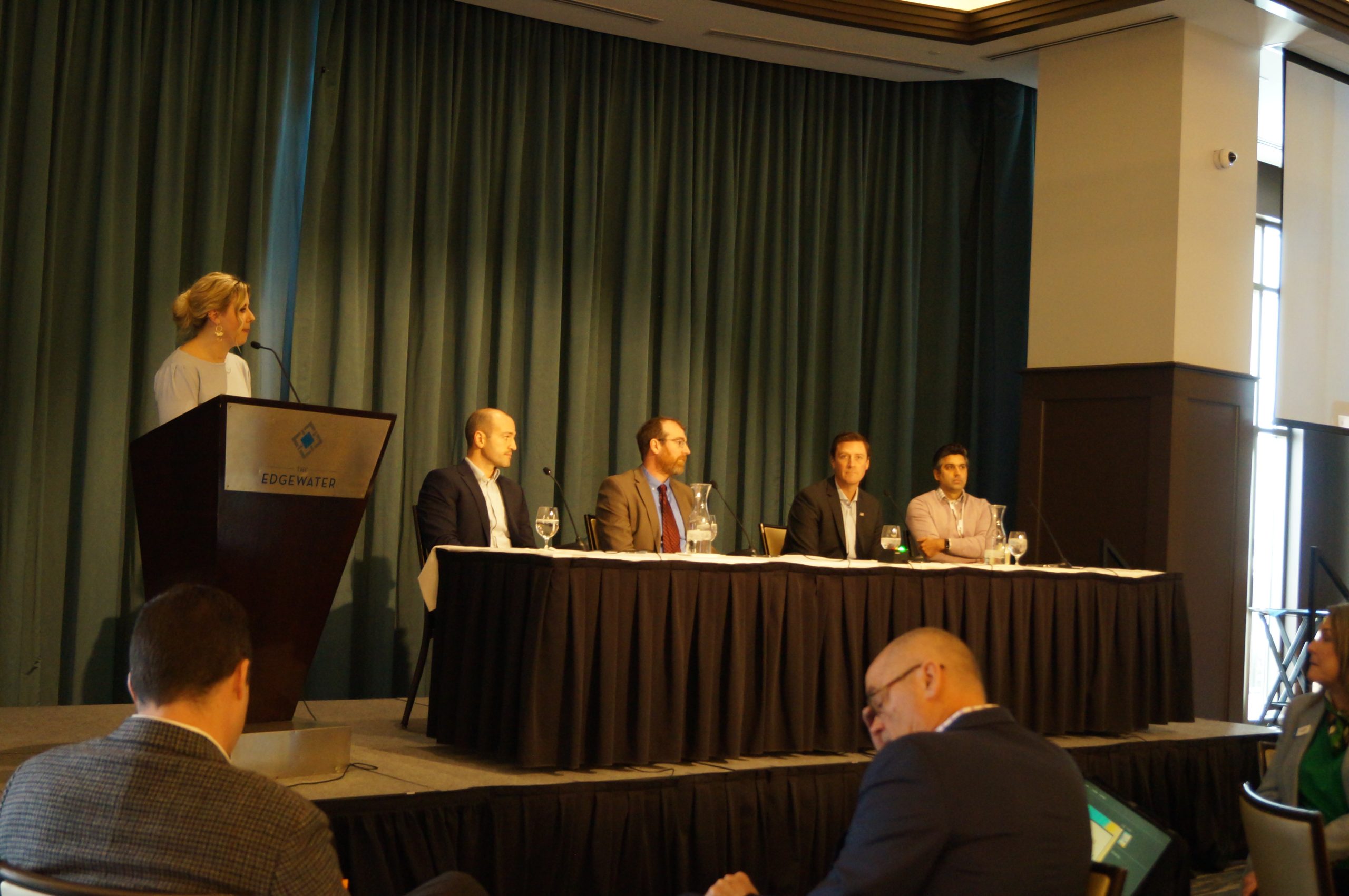 IB Madison staff reporter Brittney Kenaston moderates the data center panel at IB Madison's Real Estate & Construction Symposium. From left: panelists Alex Allon, community development director for the village of DeForest; Tyler Byrnes, senior research associate for the Wisconsin Policy Forum; Coleman Peiffer, senior manger of data center services at Alliant Energy; and Kevin Ramakrishna, shareholder in Reinhart's real estate practice.