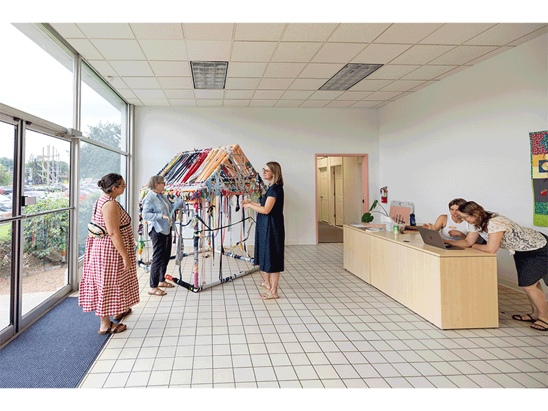Terri Messinides' Charlotte's House, on display at TAC, is made of PVC pipe, fabric, yarn and ribbon, and invites visitors to add their own wrapping and layers to the interactive project.