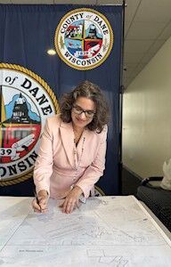 Dane County Executive Melissa Agard became the first Dane County resident to fill out the new state form renouncing the discriminatory restriction on her property deed.