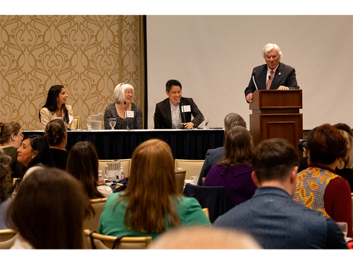 Left to right: Panelists Carissa Kathuria, a software developer and research and development group lead for Epic; Dr. Ibuki Kimura, medical informatics director for SSM Health; and Frank Liao, senior director of digital health and emerging technologies for UW Health, participate in a discussion about AI in health care, moderated by Dr. Frank Byrne, chief medical officer of Forward Health Group.