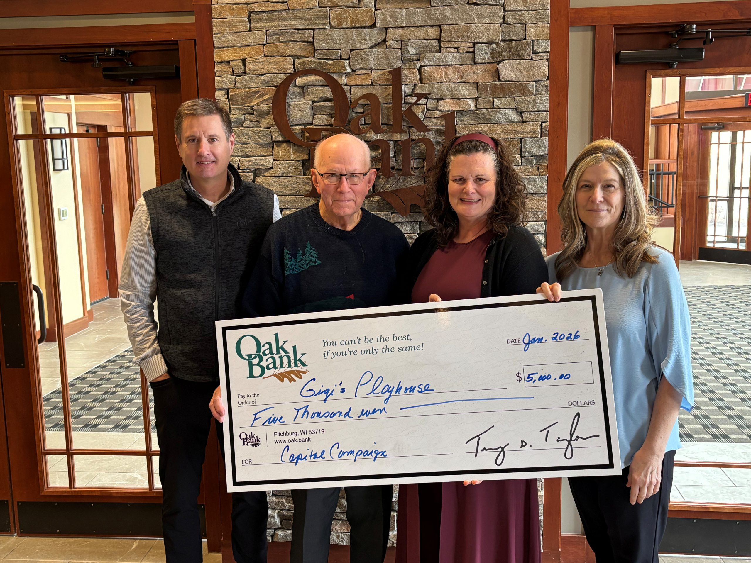 Oak Bank Donates to Gigis Playhouse BuildCampaign Big Check 2026.jpg