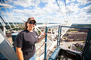 Brenda Hacker outside her “office,” high above downtown Madison. She is helping to build The Hub, a mixed-use development at the corner of State and Frances Streets.