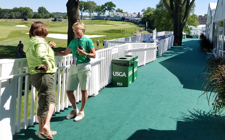 Mimi Griffin talks to a client from IBM in the USGA Partner Village at Oakmont during the 2016 U.S. Open.