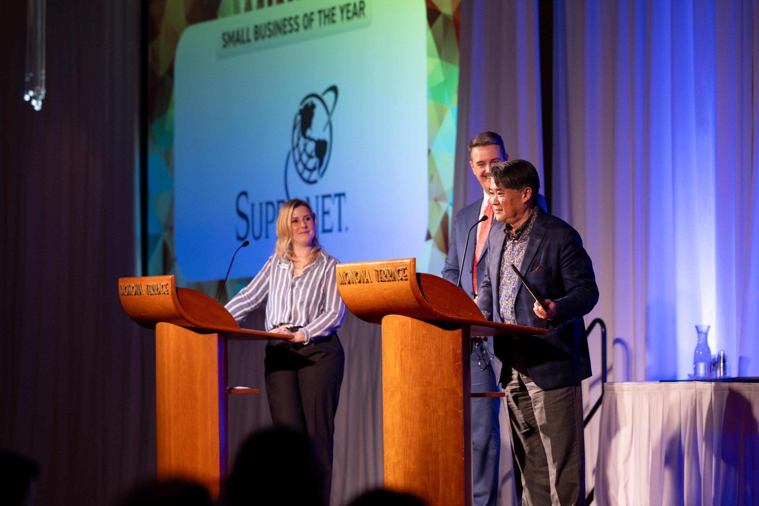 Bryan Chan, founder and CEO of SupraNet, accepts the Small Business of the Year award.
