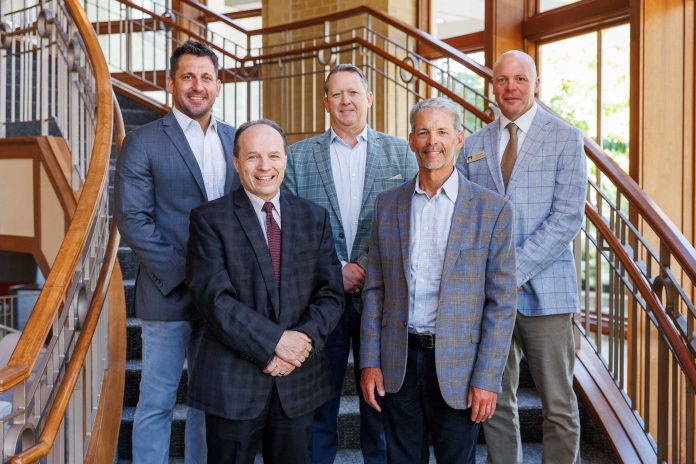 (From left) Chad Weis, general manager of Home Instead's Madison office; William Mangan, provost at Edgewood University; Linn Free, SVP-operations at Home Instead/Honor Care; Steve Nooyen, Home Instead franchise owner; and Quinn Millikin, dean of the Henry Predolin College of Health Sciences at Edgewood University.