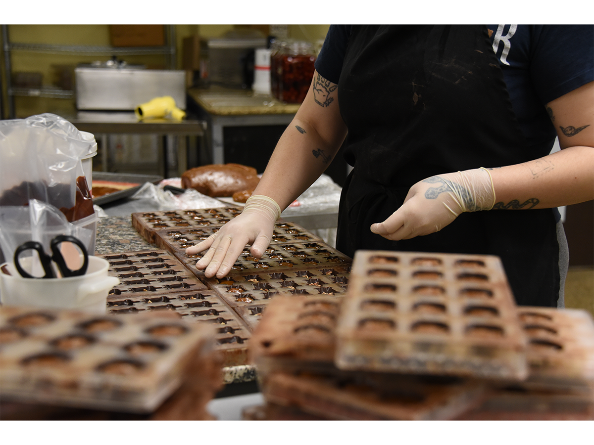 Sea Turtles, turtle-shaped chocolates filled with caramel and pecans, are prepared in time for Valentine’s Day sales.