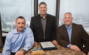 Jason Kadow, Cory Myers, and Jim Antony enjoy the view from their expanded accounting firm.