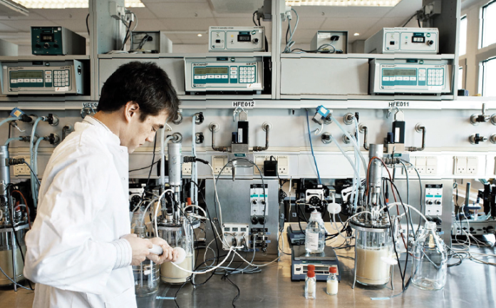 A lab worker at one of Chr. Hansen’s global facilities aids the company’s mission to advance “the power of good bacteria.”