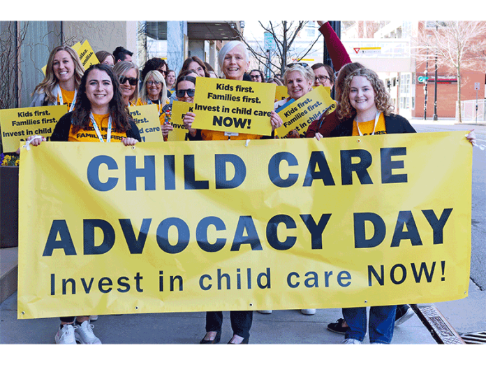Ruth Schmidt (center) led a rally for early child care funding prior to passage of the state budget.