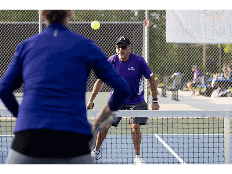 Keri Eull and Leo Papierniak face off in a pickleball match.