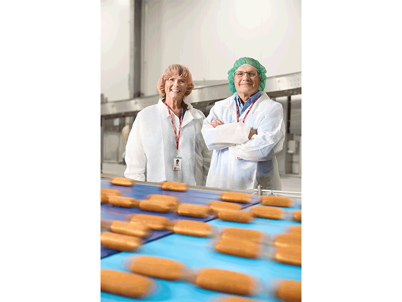 Deb Brazil, convenience transportation recruiter for Kwik Trip, stands with CEO Scott Zietlow in the Kwik Trip bakery.