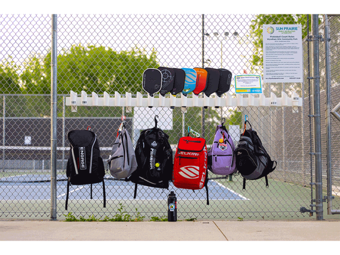 Sporting accessories are signs of the community's pickleball craze.