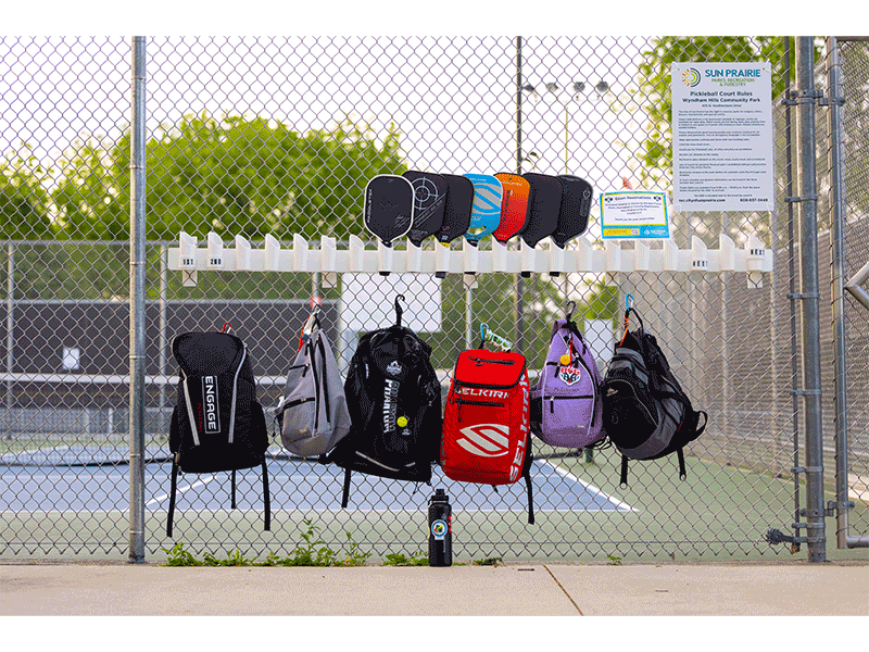 Sporting accessories are signs of the community's pickleball craze.