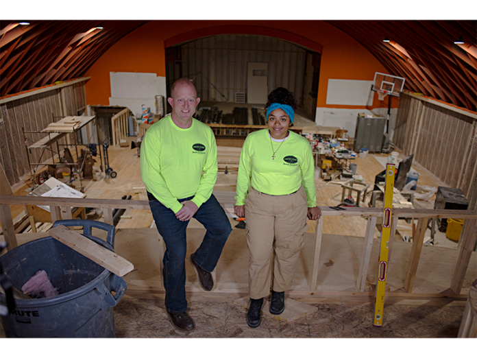 Steve Gardner, director of OFS' Build Academy program, and Jamyia Rex-Dean, a program participant, are helping to transform the Atwood Music Hall.