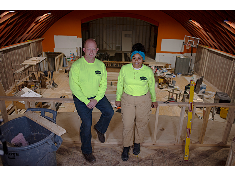 Steve Gardner, director of OFS' Build Academy program, and Jamyia Rex-Dean, a program participant, are helping to transform the Atwood Music Hall.