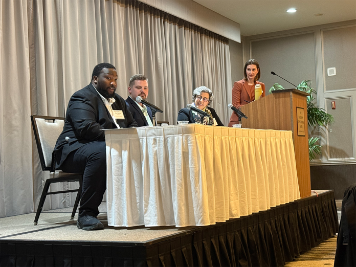 Panelists from left to right were State Rep. Darrin Madison, State Rep. Nate Gustafson and Rima Alaily, corporate vice president and general counsel of infrastructure legal affairs for Microsoft. At the lectern was moderator Maggie Brickerman, president of the Wisconsin Technology Council.