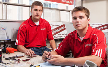 Men at work: Austin Larsh (left) and Charles Rodenkirch have dialed up a new, Wisconsin-focused business model for cellular phone repair.