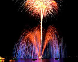 Boats are in silhouette as fireworks light up the sky during Lights On The Lake in 2012.