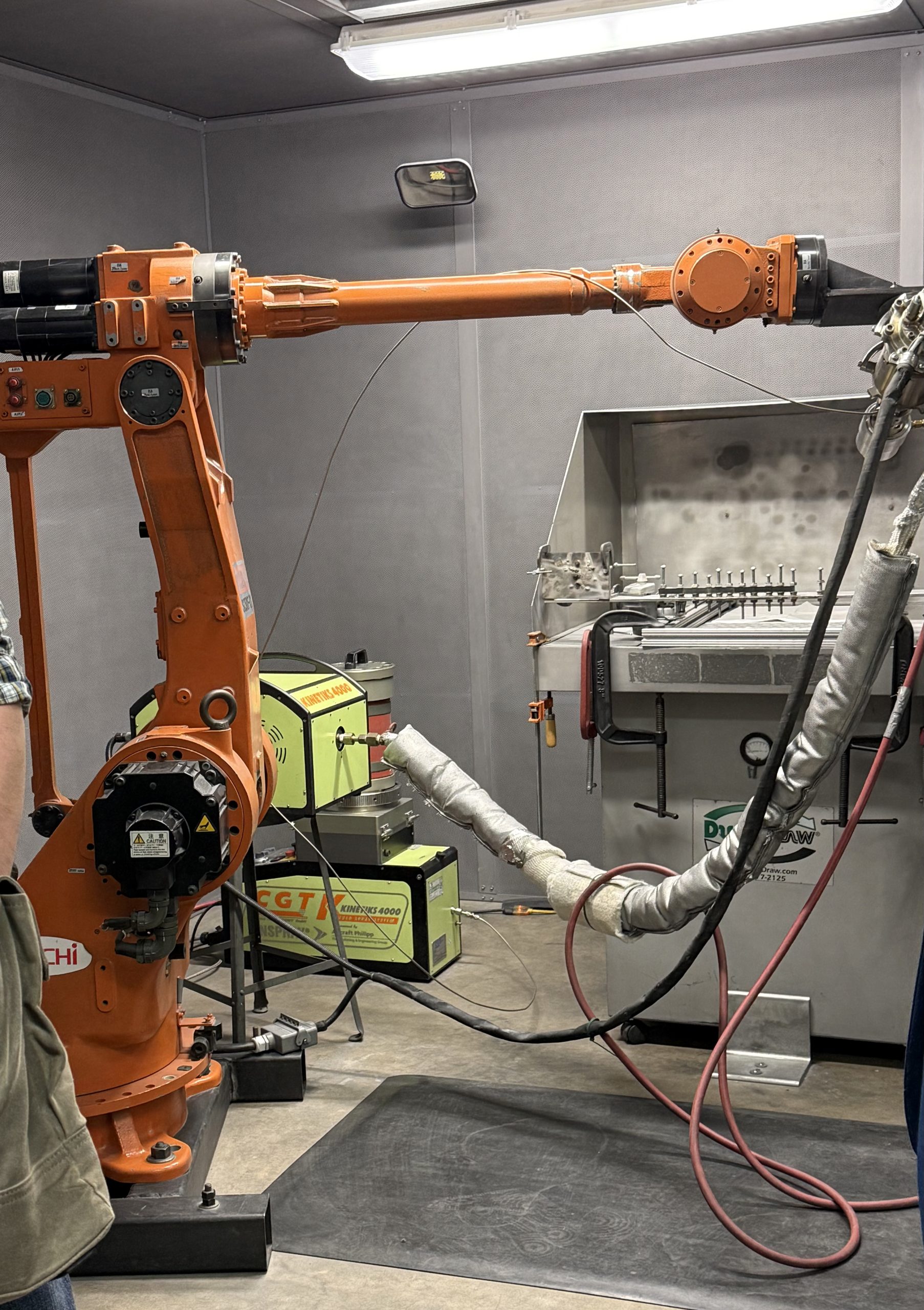 Some summit attendees toured labs, like UW-Madison's Cold Spray Lab, focused on manufacturing metal coatings (with devices like the one above) for fusion devices that can better resist their extreme conditions.