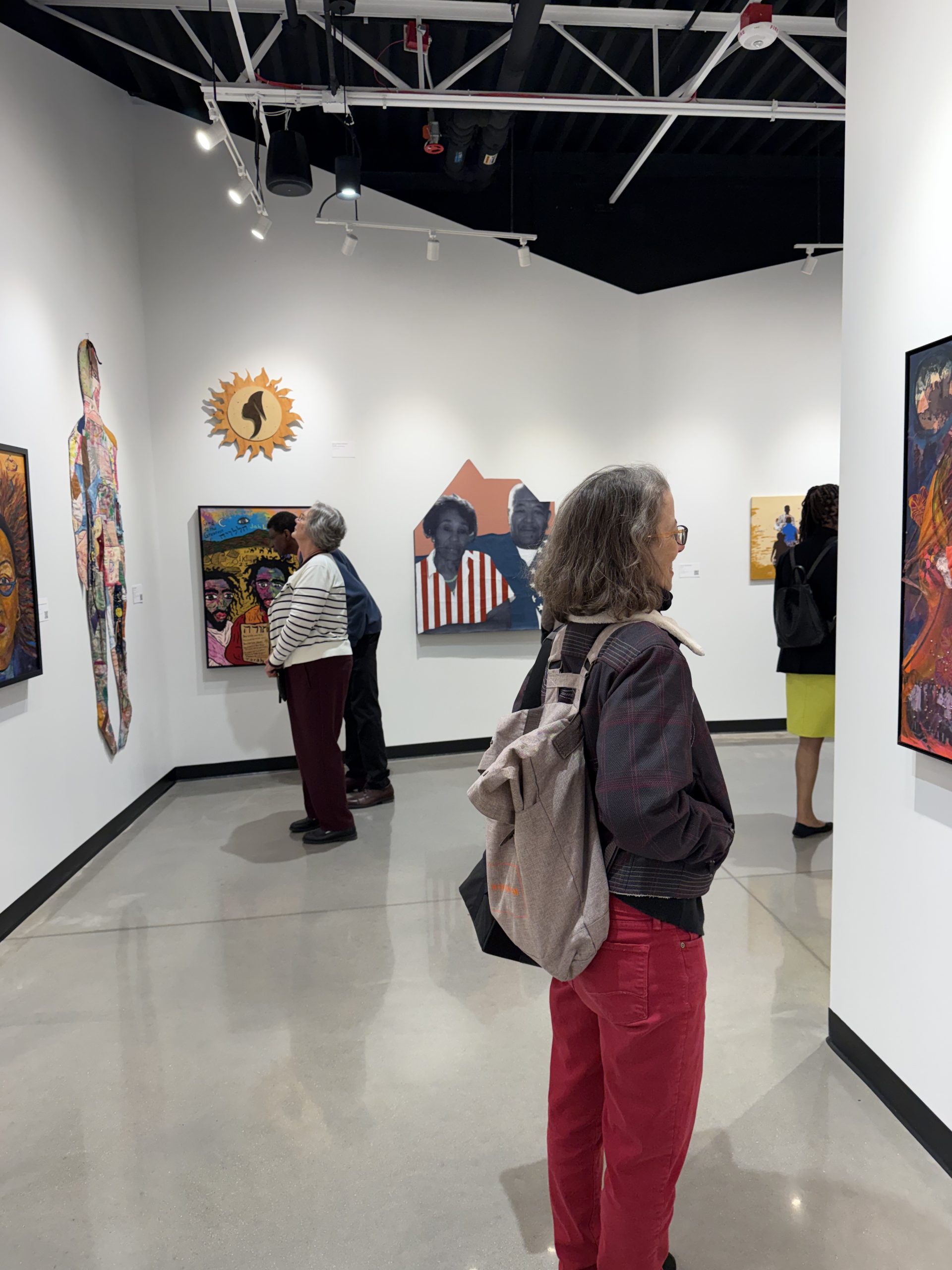 Visitors admired the works of local Black artists on display in the Center's art gallery.