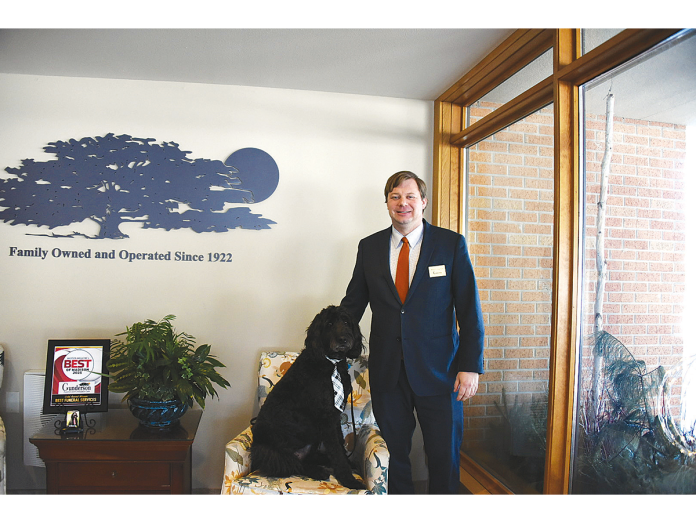 Elmer with owner Matt Gunderson, a fourth-generation owner and operator of Gunderson Funeral Home in Madison.