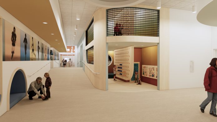 A mock-up of a school expansion shows a wide hall and people walking around