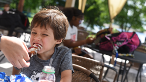 A child enjoys French toast sticks from Marigold's new food cart.