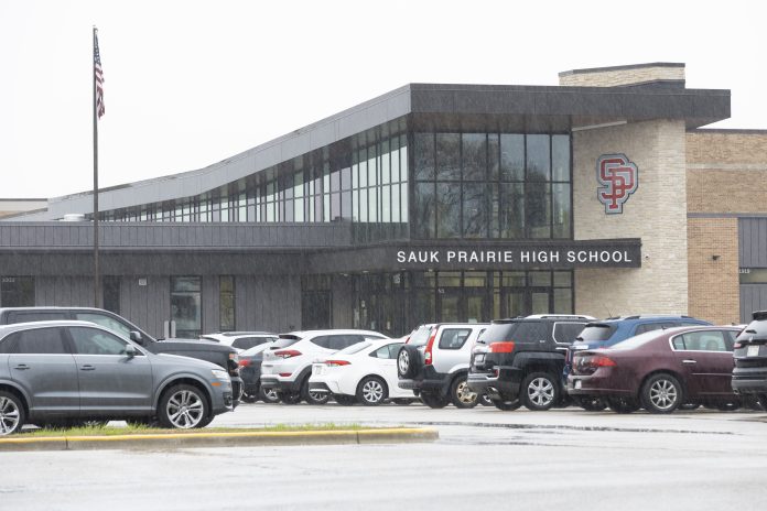 Rain falls outside Sauk Prairie High School on April 27, 2026, in Prairie du Sac, Wis. The Sauk Prairie School District is one of 26 Wisconsin school districts where voters denied referendums in the recent spring election. District leaders are now seeking other funding sources and making cuts to areas that would have been funded by the referendum. (Joe Timmerman / Wisconsin Watch)