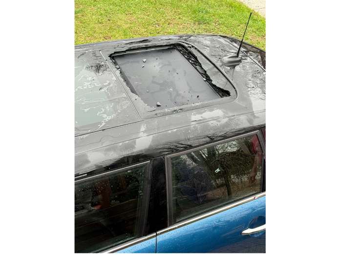 The sunroof of John Stevenson's Mini Cooper was smashed Tuesday.