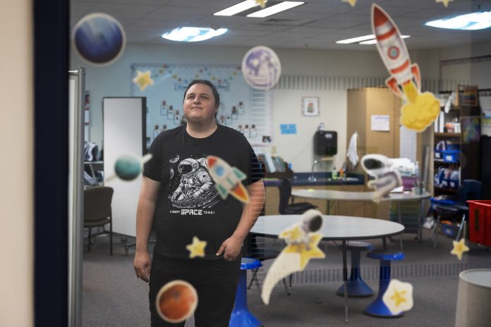 Matthew Jacobson, a teacher apprentice, poses for a photo in a Brookfield Elementary School classroom on May 22, 2026, in Brookfield, Wis. Jacobson is one of only eight apprentices in the statewide program. (Joe Timmerman / Wisconsin Watch)
