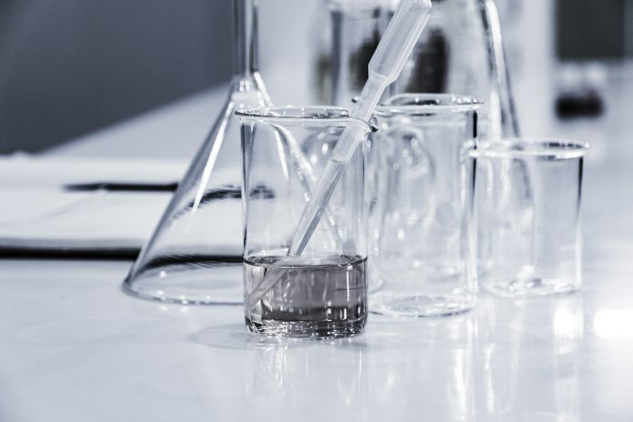 Beakers and test tubes in a clean lab.
