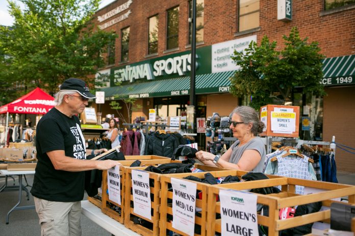 A person on State Street looks at clothing