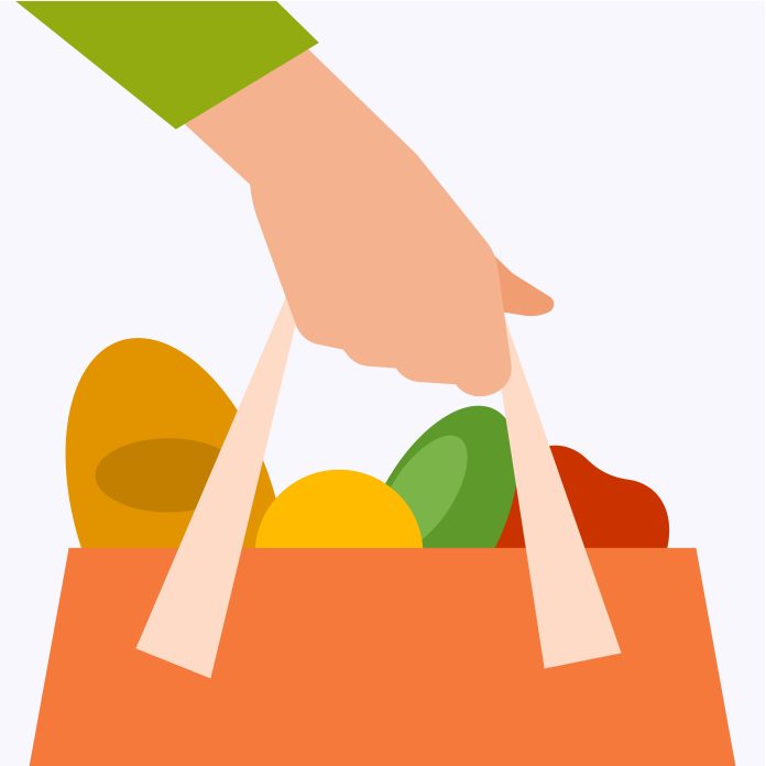 A hand holding a bag of groceries
