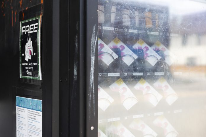 A black Narcan vending machine