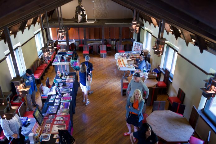 A view of a large hall with arts and local goods